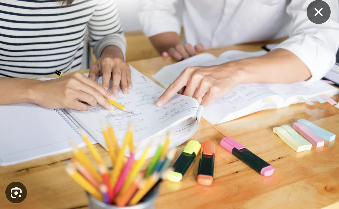 Tutoring session with student and teacher